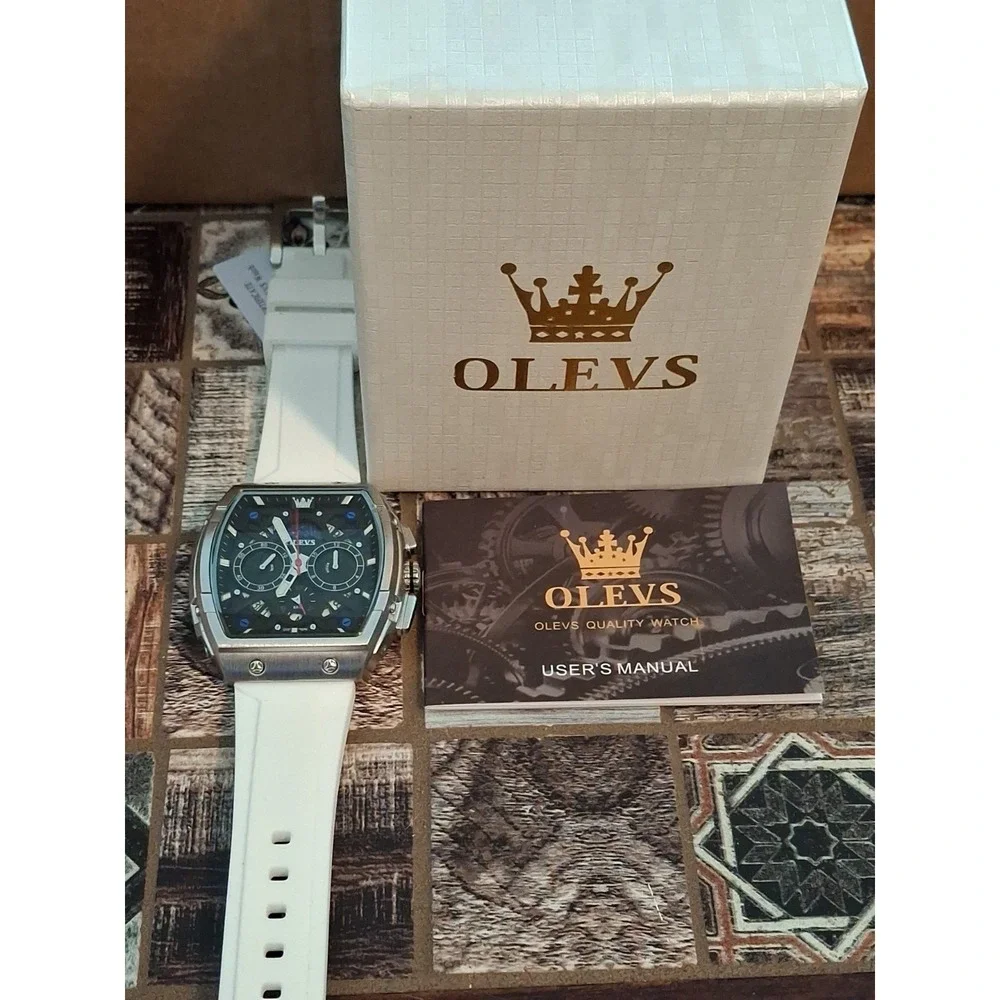 NIB OLEVS 2942G Mens Watch. Chrono W/Moon Phase Calendar,SS Case,White Strap.